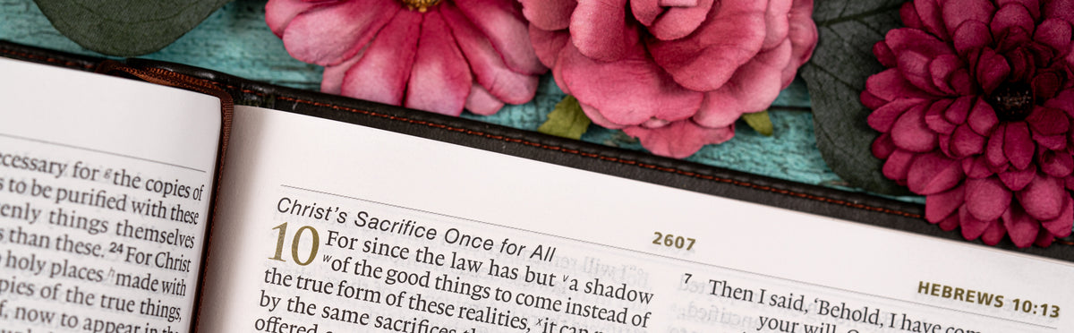 Open book with a decorative floral border