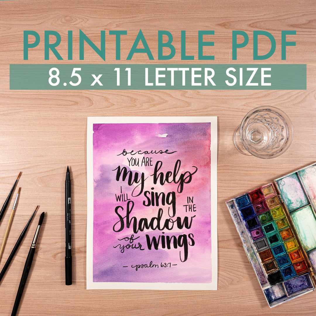 Printable PDF poster with motivational quote on a wooden surface with art supplies.